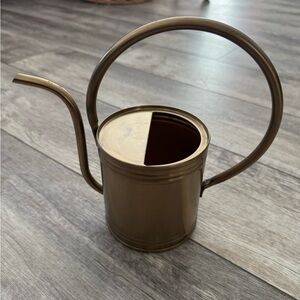 Small brass toned watering can